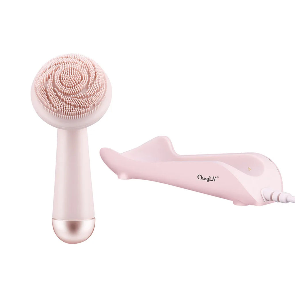 Pink silicone facial cleansing brush with CkeyiN charging dock — complete package contents, white background