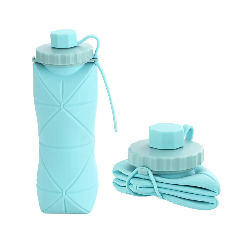 Foldable silicone water bottle in Ocean Blue shown upright and folded flat, with carrying strap – 600ml portable reusable bottle