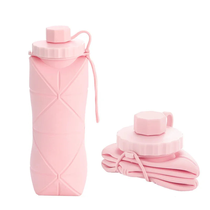 Foldable silicone water bottle in Pink Blush shown upright and folded flat, with carrying strap – 600ml portable reusable bottle