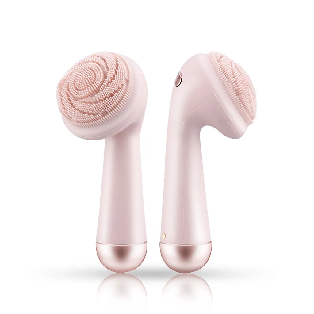 Pink silicone facial cleansing brush front and back view showing bristle head side and roller massage side, white background
