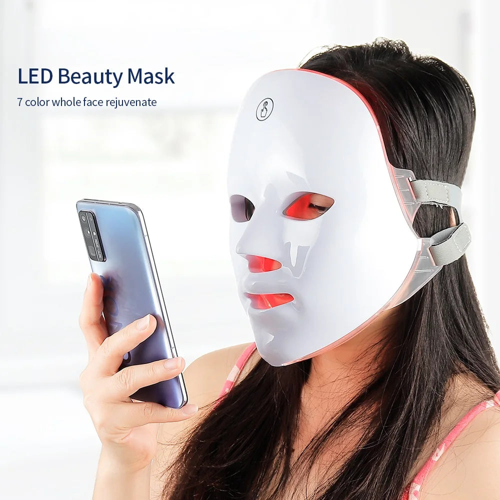 Woman wearing 7-Colours LED Light Therapy Face Mask for at-home skin rejuvenation treatment